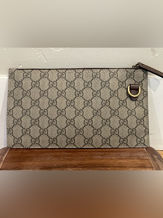 Gucci Handbags - Gucci Beige and Brown GG Canvas Pouch with Gold Ring. NWOT Grab her!